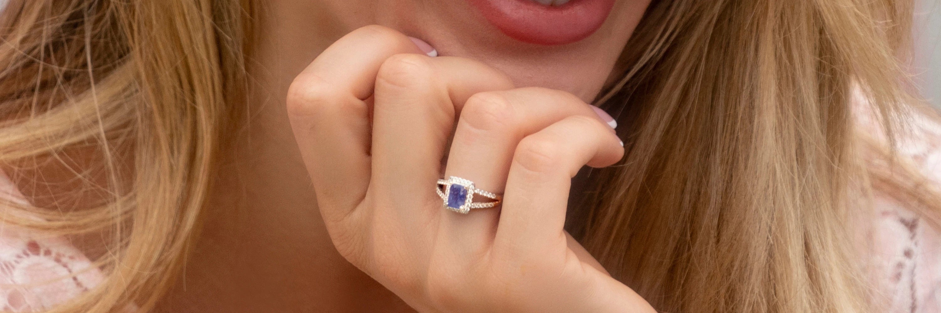 Model wearing Cavell Classic Allure sterling silver ring with natural gemstone surrounded by cubic zirconia accents, featuring hidden rose quartz gemstone inside the band