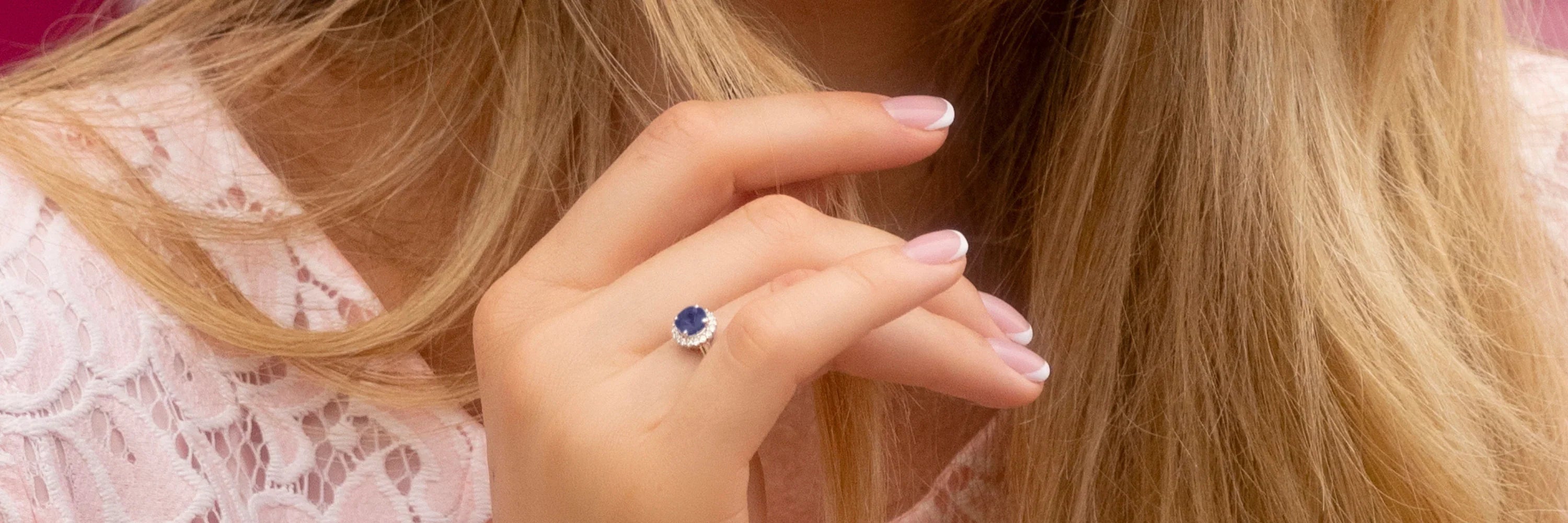 Model wearing Cavell Eternal Love sterling silver ring featuring a natural gemstone surrounded by cubic zirconia accents with hidden rose quartz gemstone inside the band