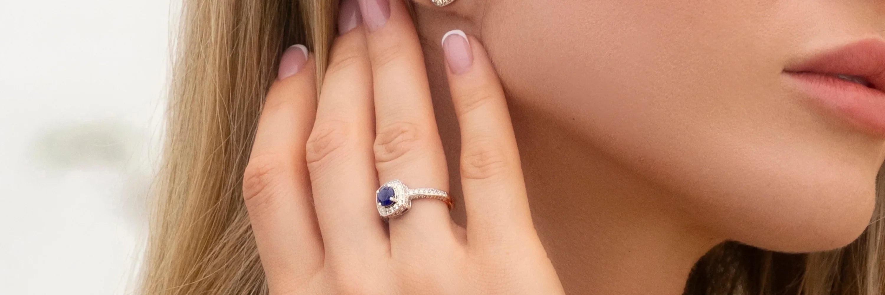 Cavell Touch of Luxury collection cover image featuring a woman wearing a natural gemstone ring, crafted in sterling silver with hidden rose quartz for depth, serenity, and timeless elegance