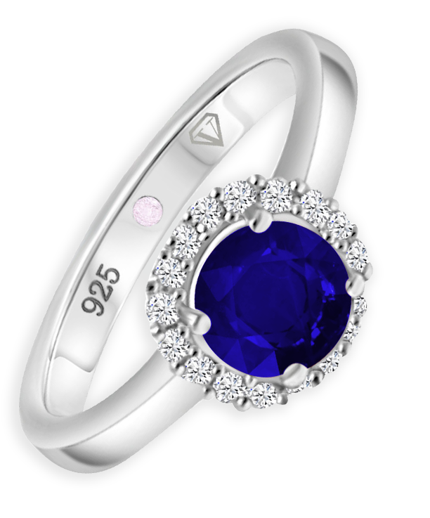 Angled view of Cavell Eternal Love sterling silver ring featuring a natural sapphire gemstone surrounded by round-cut cubic zirconia accents and hidden rose quartz gemstone inside the band