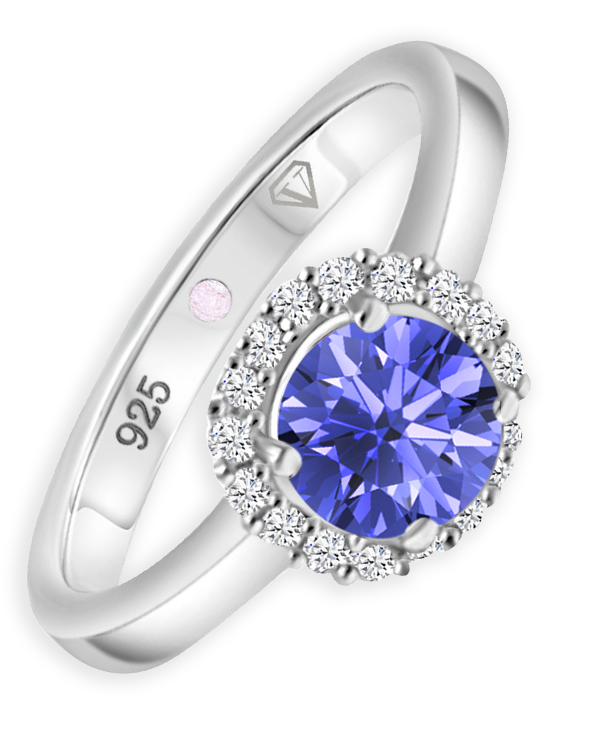 Angled view of Cavell Eternal Love sterling silver ring featuring a natural tanzanite gemstone surrounded by round-cut cubic zirconia accents and hidden rose quartz gemstone inside the band