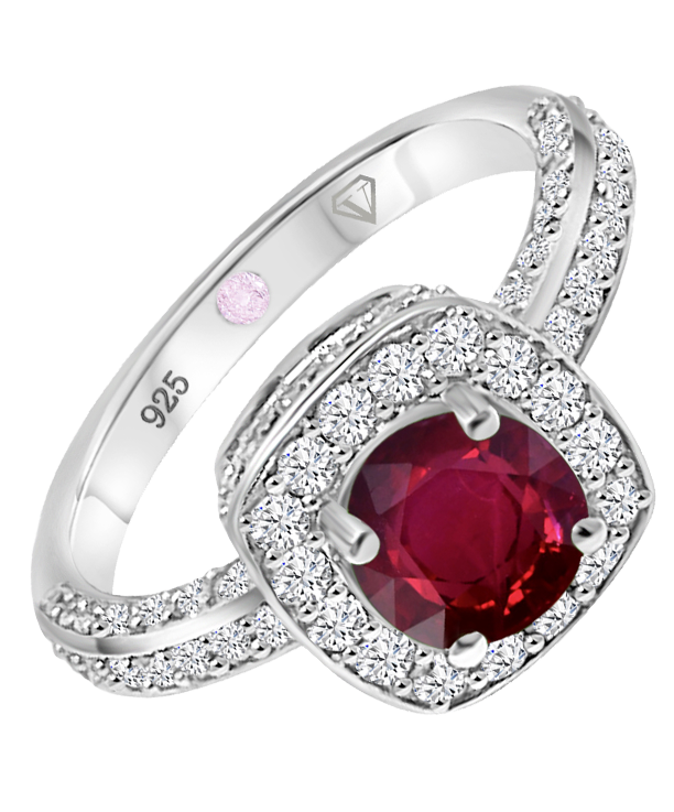 Angled view of Cavell Everlasting Devotion sterling silver ring featuring a natural ruby gemstone surrounded by round-cut cubic zirconia accents and hidden rose quartz gemstone inside the band