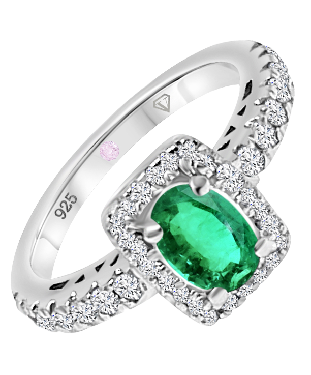 Angled view of Cavell Feel Timeless sterling silver ring featuring a natural emerald gemstone surrounded by round-cut cubic zirconia accents and hidden rose quartz gemstone inside the band