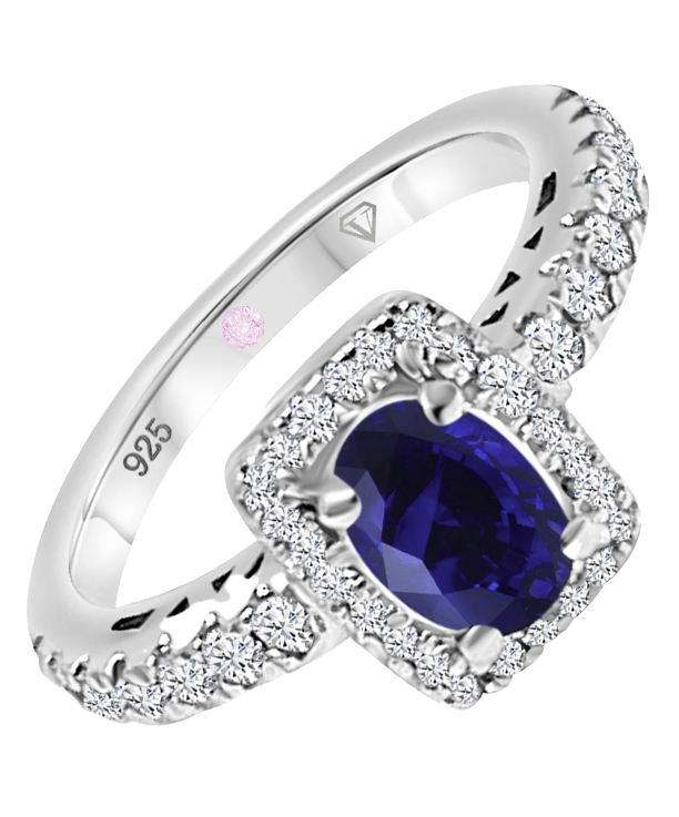 Angled view of Cavell Feel Timeless sterling silver ring featuring a natural sapphire gemstone surrounded by round-cut cubic zirconia accents and hidden rose quartz gemstone inside the band