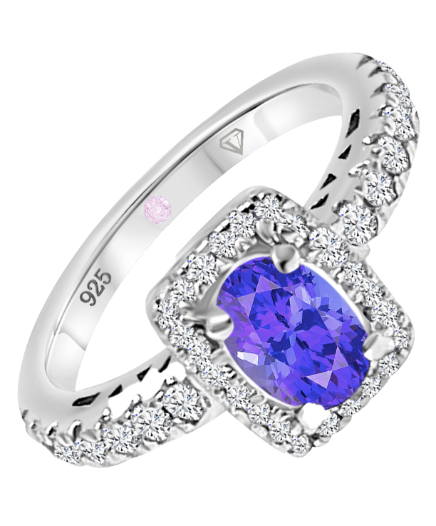 Angled view of Cavell Feel Timeless sterling silver ring featuring a natural tanzanite gemstone surrounded by round-cut cubic zirconia accents and hidden rose quartz gemstone inside the band