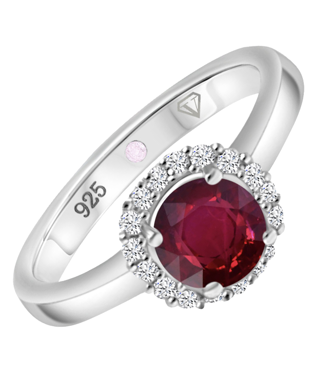 Angled view of Cavell Eternal Love sterling silver ring featuring a natural ruby gemstone surrounded by round-cut cubic zirconia accents and hidden rose quartz gemstone inside the band