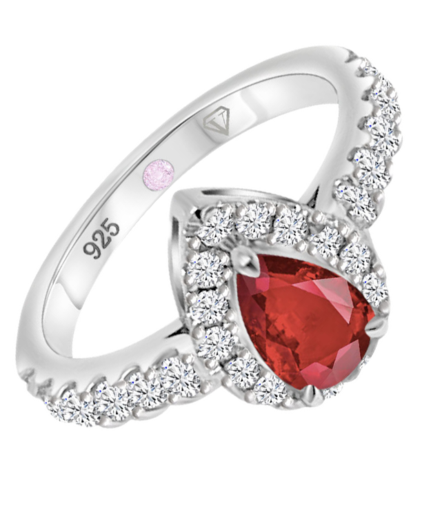 Angled view of Cavell Drop of Passion sterling silver ring featuring a natural ruby gemstone surrounded by round-cut cubic zirconia accents and hidden rose quartz gemstone inside the band