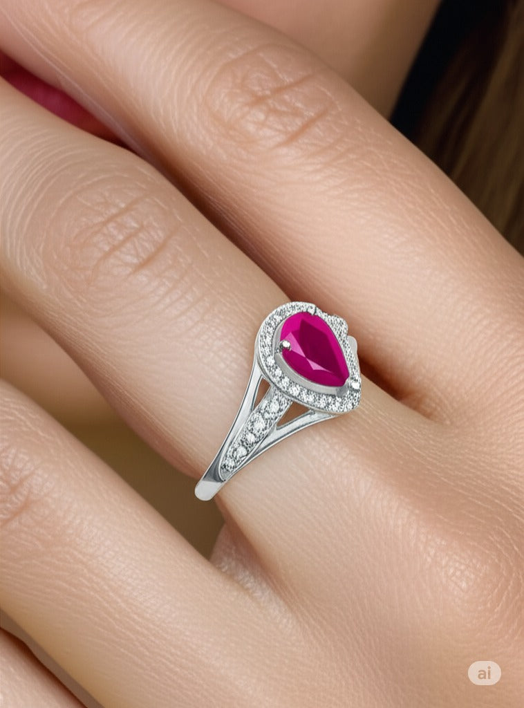 Model wearing Cavell Tear Drop of Joy natural ruby ring in sterling silver surrounded by round-cut cubic zirconia accents