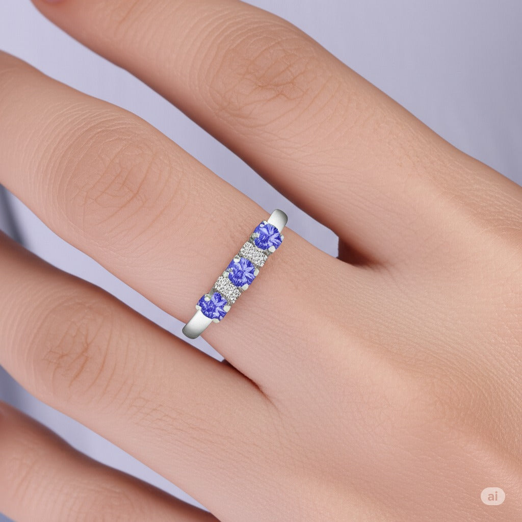 Model wearing Cavell Trilogy of Loyalty natural tanzanite ring in sterling silver surrounded by round-cut cubic zirconia accents