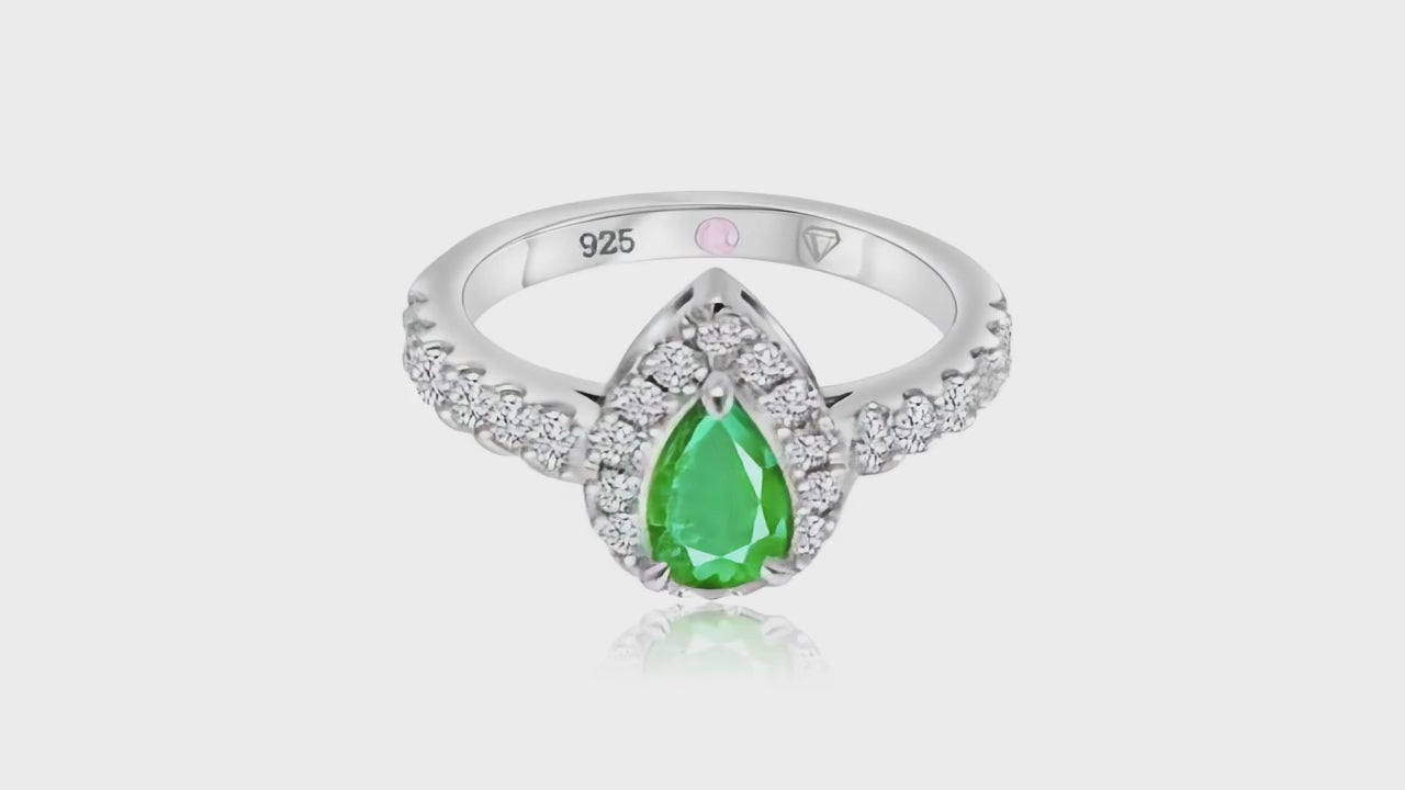 360° video of Cavell Drop of Passion natural emerald ring in sterling silver surrounded by round-cut cubic zirconia accents with hidden rose quartz gemstone inside