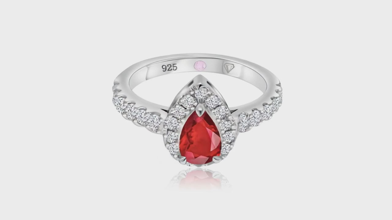 360° video of Cavell Drop of Passion natural ruby ring in sterling silver surrounded by round-cut cubic zirconia accents with hidden rose quartz gemstone inside