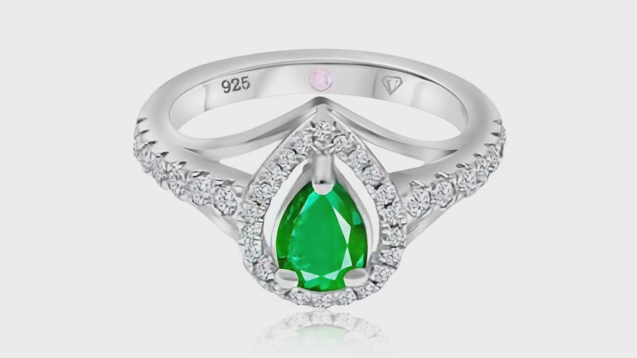 360° video of Cavell Tear Drop of Joy natural emerald ring in sterling silver surrounded by round-cut cubic zirconia accents with hidden rose quartz gemstone inside