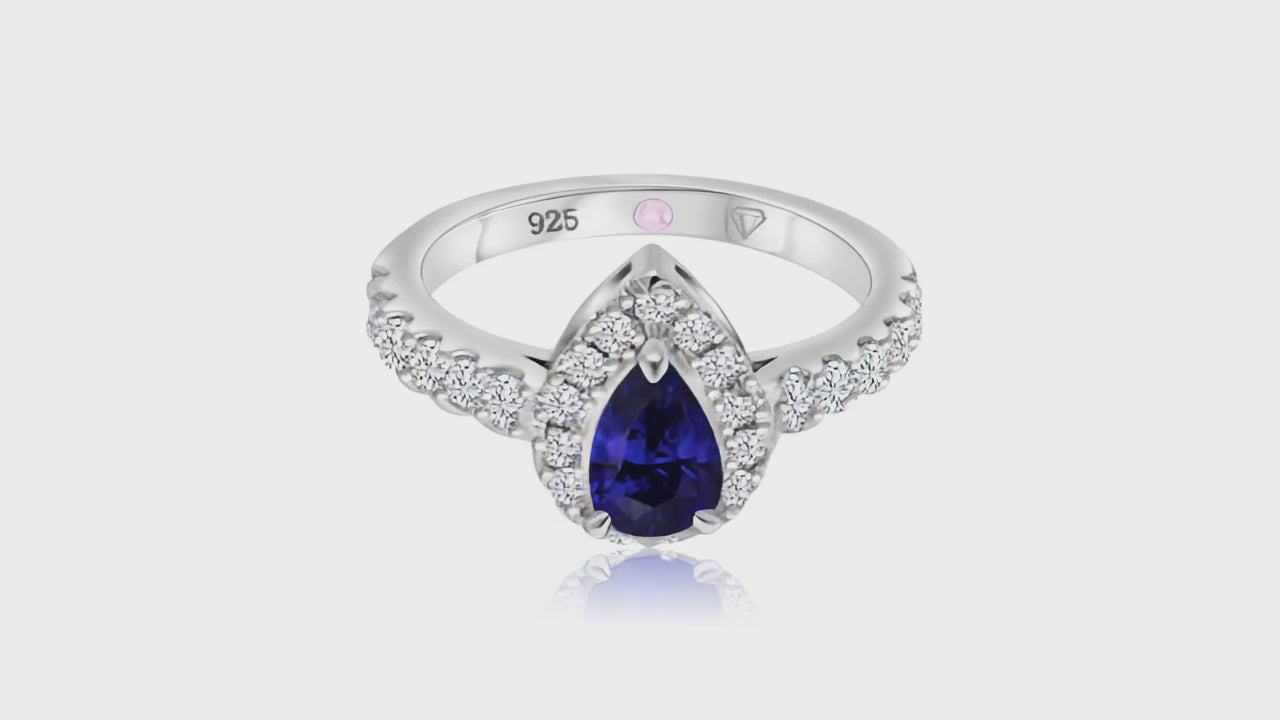 360° video of Cavell Drop of Passion natural sapphire ring in sterling silver surrounded by round-cut cubic zirconia accents with hidden rose quartz gemstone inside