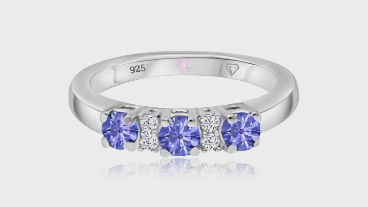 360° video of Cavell Trilogy of Loyalty natural emerald ring in sterling silver surrounded by round-cut cubic zirconia accents with hidden rose quartz gemstone inside