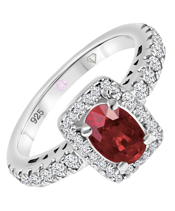 Angled view of Cavell Feel Timeless sterling silver ring featuring a natural ruby gemstone surrounded by round-cut cubic zirconia accents and hidden rose quartz gemstone inside the band