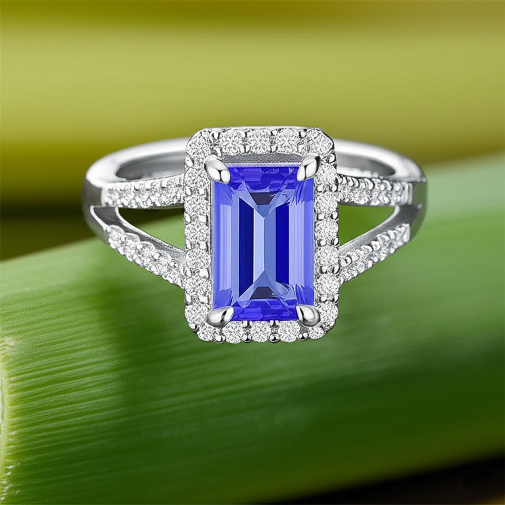 Cavell Classic Allure natural tanzanite ring in sterling silver surrounded by round-cut cubic zirconia accents placed on a surface