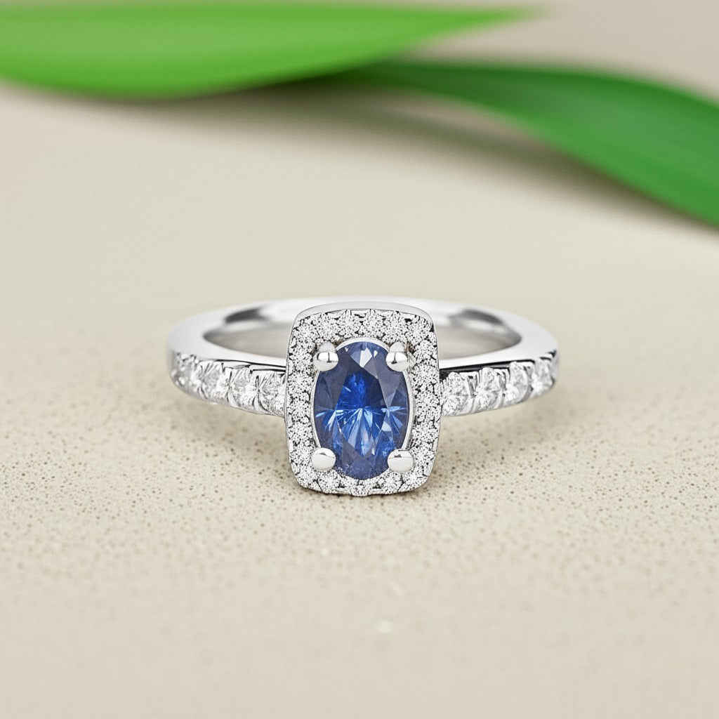 Cavell Feel Timeless natural tanzanite ring in sterling silver surrounded by round-cut cubic zirconia accents placed on a surface