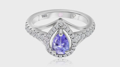 360° video of Cavell Tear Drop of Joy natural tanzanite ring in sterling silver surrounded by round-cut cubic zirconia accents with hidden rose quartz gemstone inside