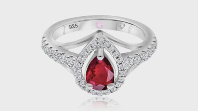 360° video of Cavell Tear Drop of Joy natural ruby ring in sterling silver surrounded by round-cut cubic zirconia accents with hidden rose quartz gemstone inside