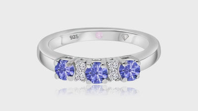 360° video of Cavell Trilogy of Loyalty natural emerald ring in sterling silver surrounded by round-cut cubic zirconia accents with hidden rose quartz gemstone inside